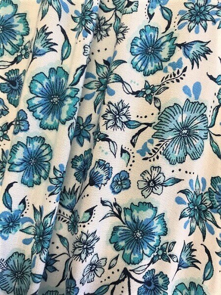 Zoom in pale blue floral fabric